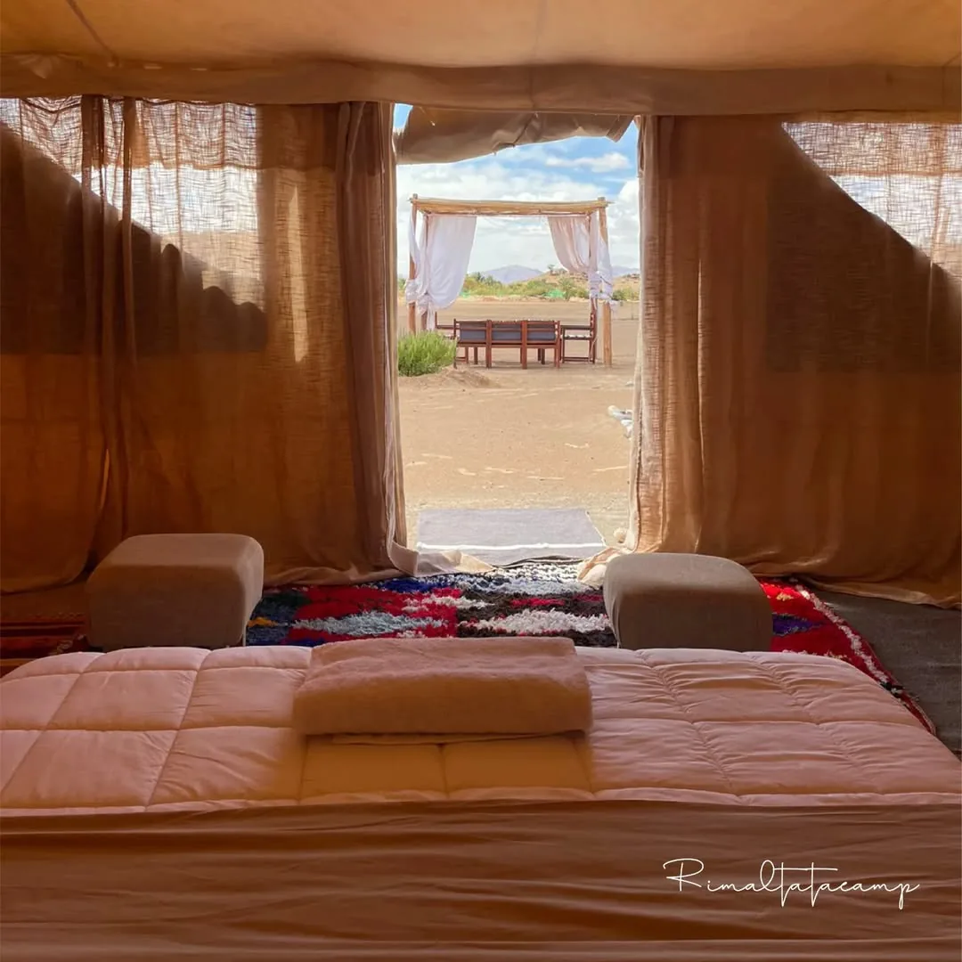 View from inside a tent opening onto the desert