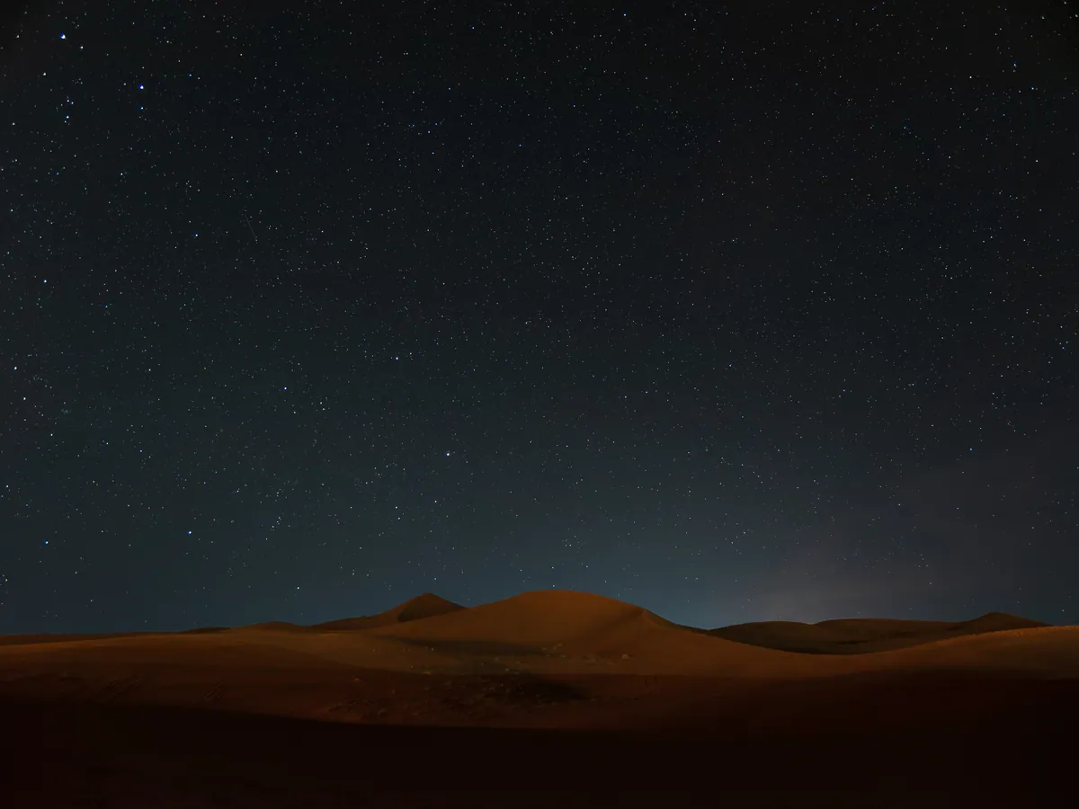 Stars above dunes in the Moroccan Sahara, an illustrative night-sky photograph